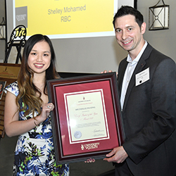 Michelle Duong receiving award from employer